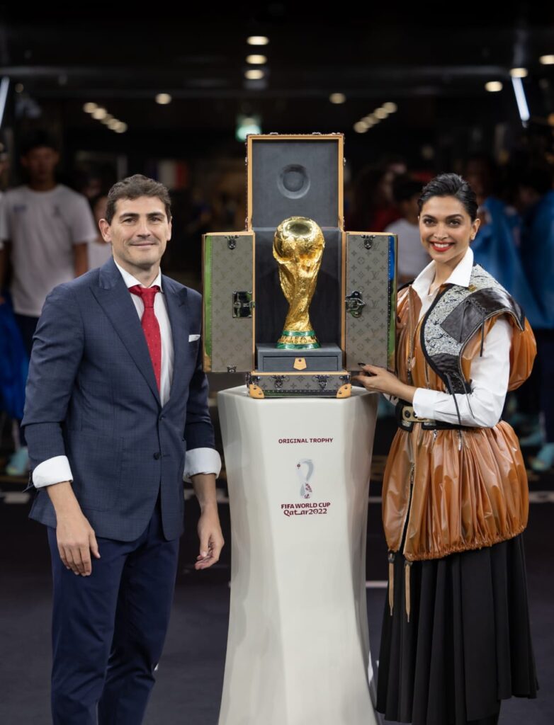 Deepika Padukone wears Louis Vuitton while presenting the FIFA World Cup Trophy in its Louis Vuitton Trunk at the FIFA World Cup Final.